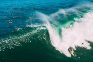 Aerial View of People Surfing on Big Waves