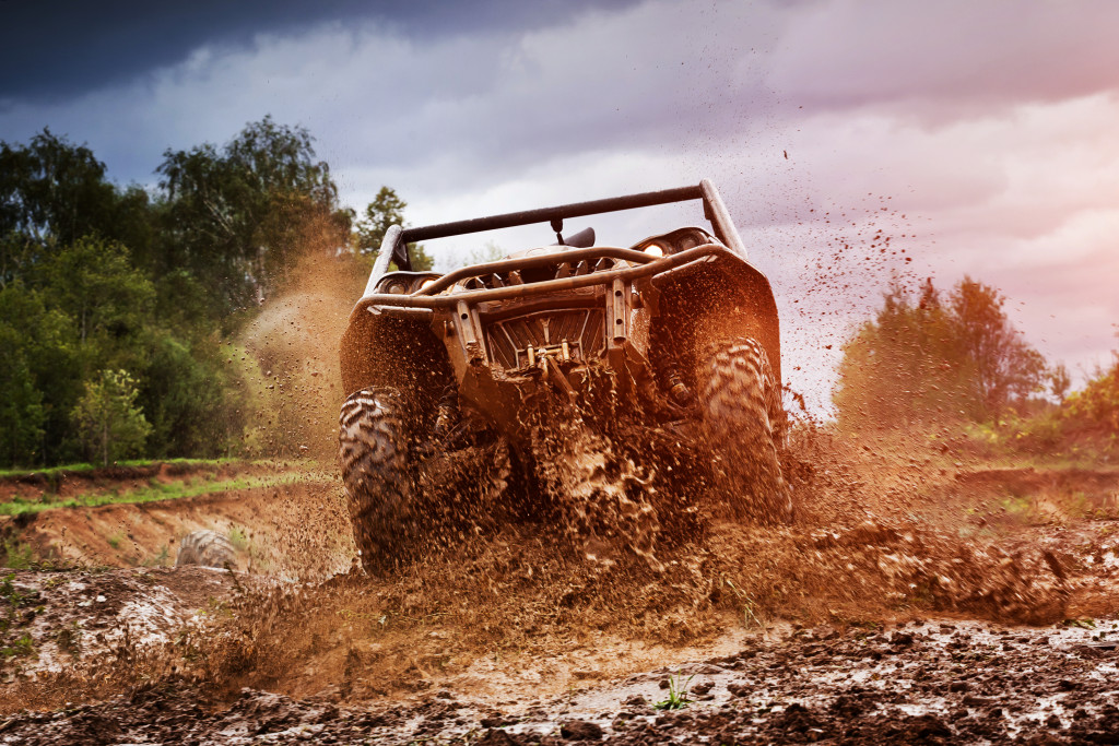 ATV going through a muddy trail.