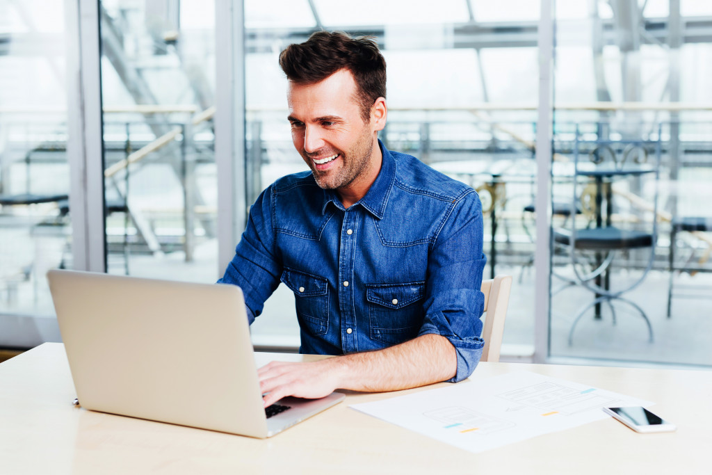 a man using a laptop 