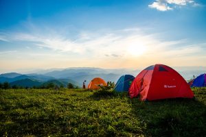 Photo of Pitched Dome Tents Overlooking Mountain Ranges