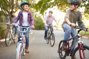 A family riding bikes outdoors
