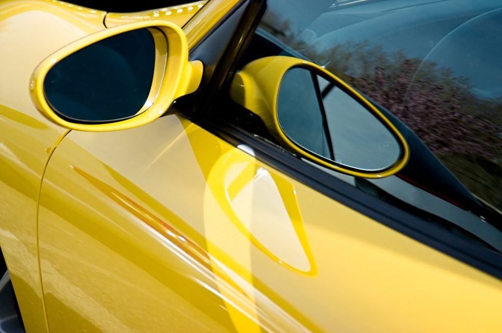side mirror on a yellow car